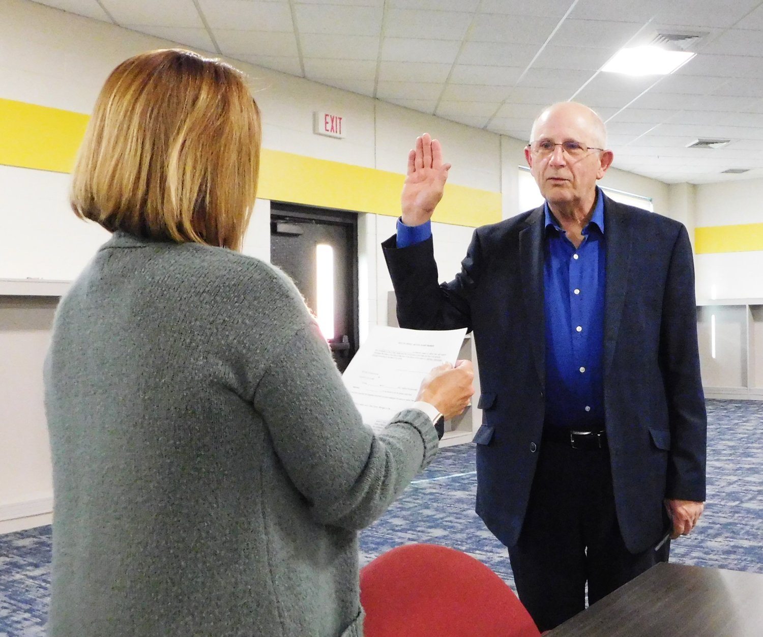 Newly-appointed HCS Board of Education Trustee Tom House takes the oath of office immediately following the special meeting held to interview candidates.